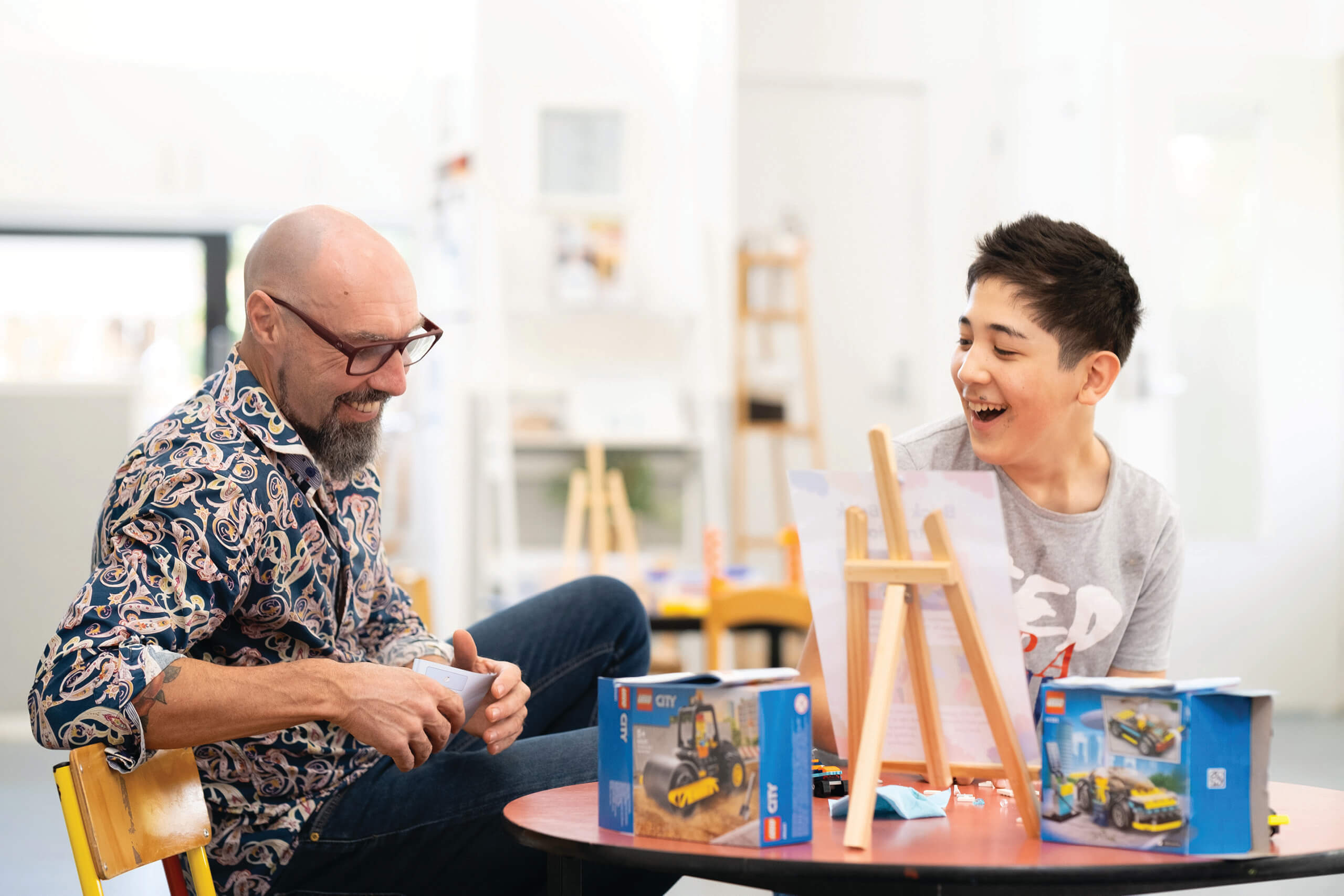 Man and boy build lego